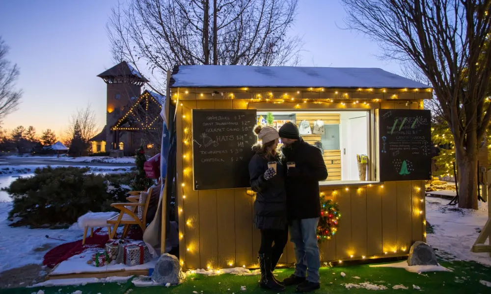 Couple standing in front of Schnapps Shack.