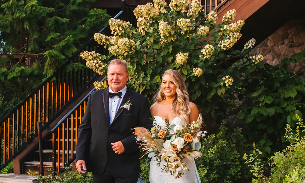 Bride walking down the aisle at Wedding Garden ceremony space at Crystal Springs Country Club. 