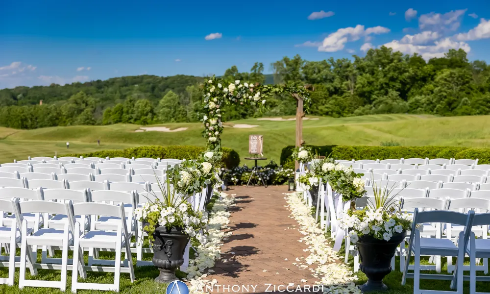 Ballyowen Wedding Garden ceremony featuring white chairs and floral arch.