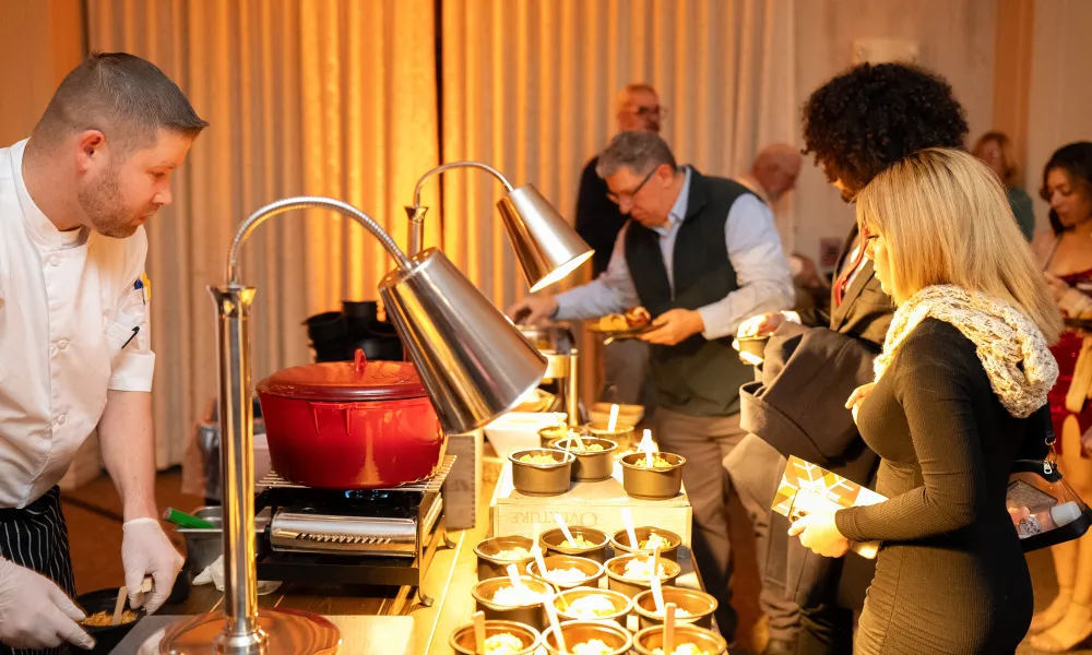 Chef's serving food in Diamond Cocktail Room. 