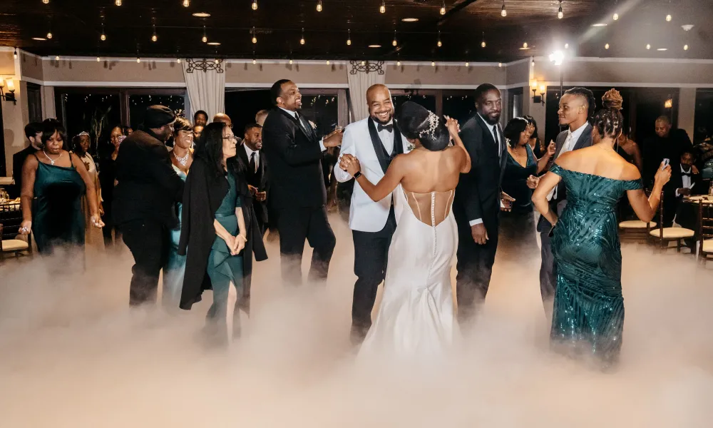 Guests dancing during reception at Bailigh Bluff House wedding reception.