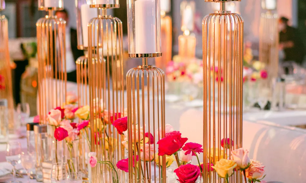 Table decor featuring pink flowers at wedding reception in Big Sky Pavillion.