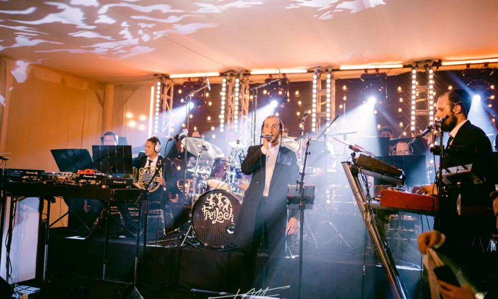 Band singing during wedding reception in Big Sky Pavillion.