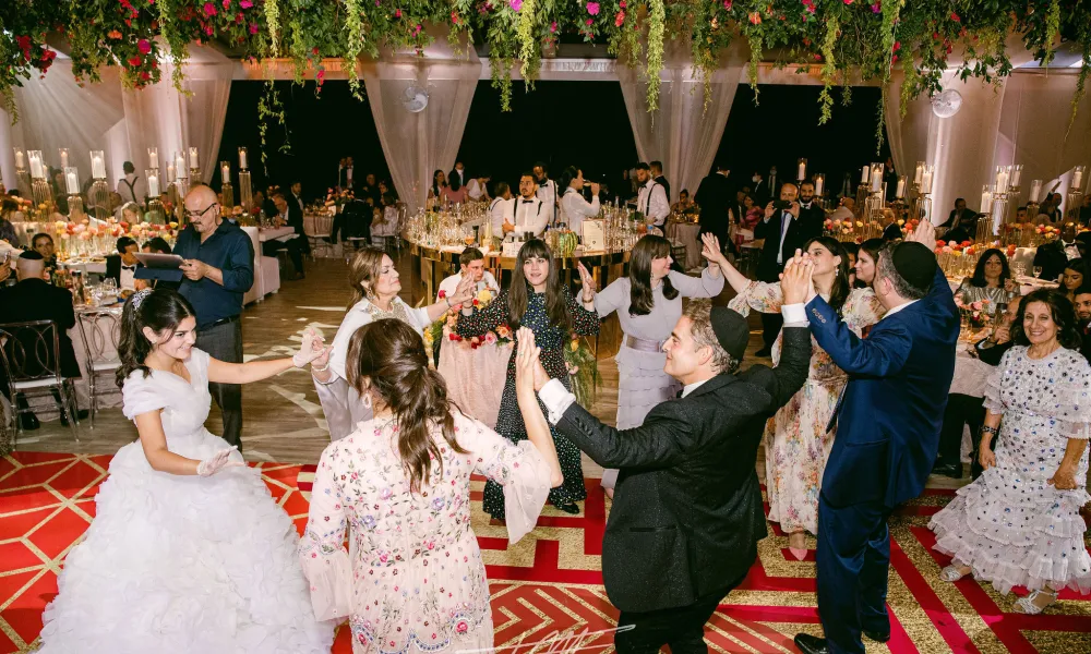 Guests dancing during wedding reception at Big Sky Pavillion.