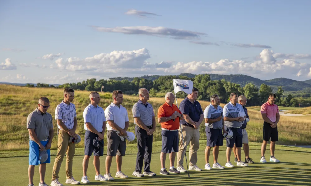 Ballyowen Law Enforcement Open golfers standing during National Anthem.