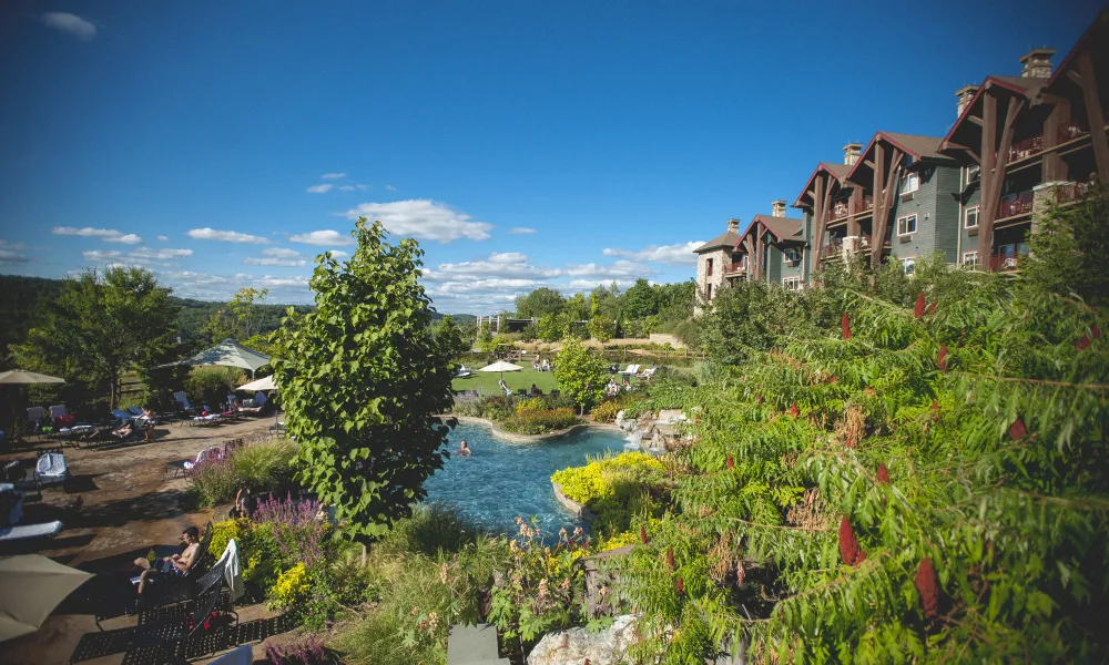 Outdoor Biosphere Pool Complex with Grand Cascades Lodge on right side.