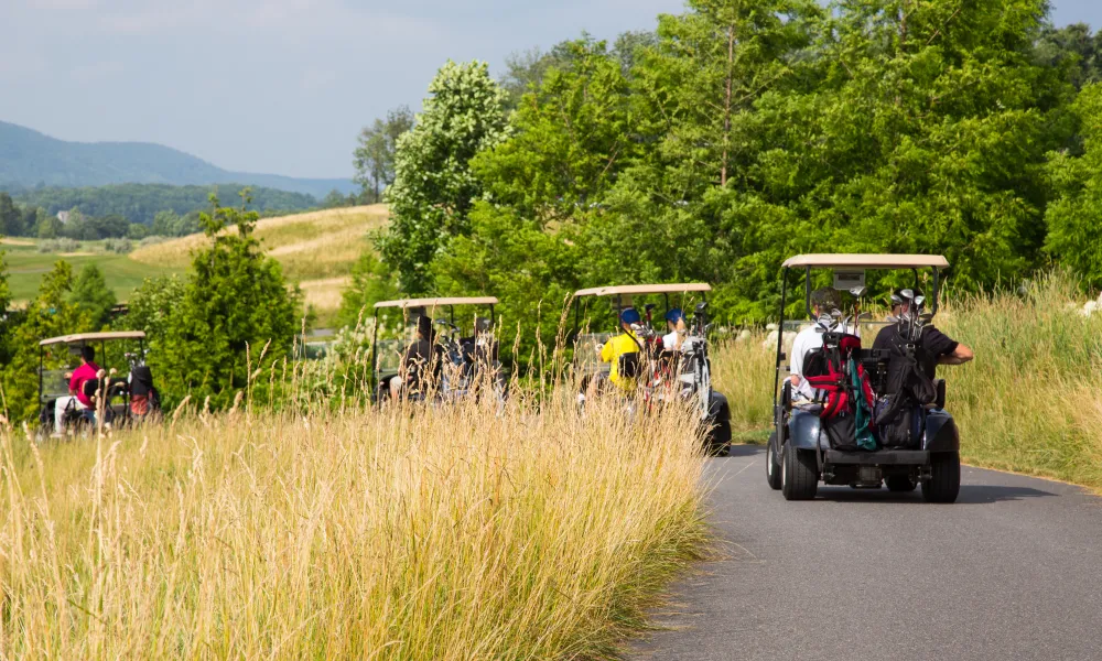 Golf carts driving to their next hole at Cascades Golf Course at Crystal Springs Resort