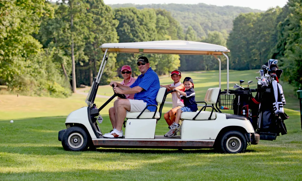 Parents with their kids on a family friendly golf course at Crystal Springs Resort in New Jersey.