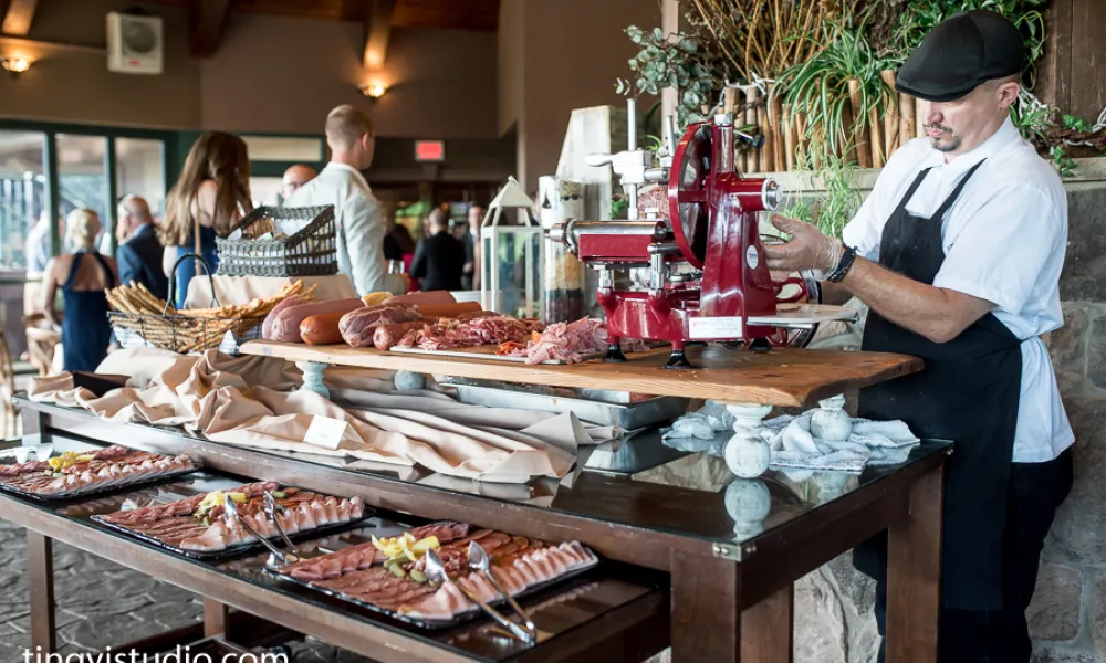 Banquet chef slicing meat for Charcuterie display