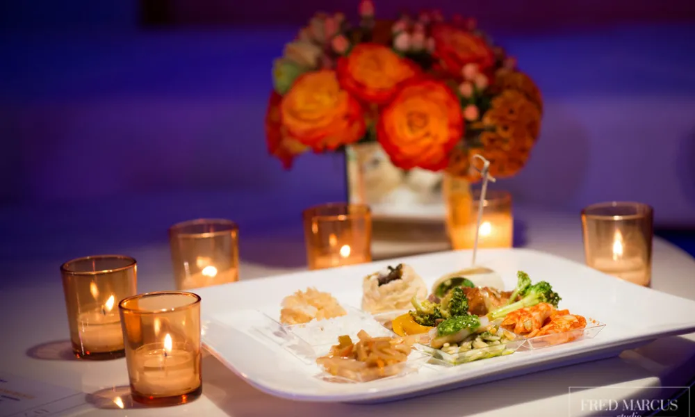 Small hors d'oeuvres plate surrounded by candles