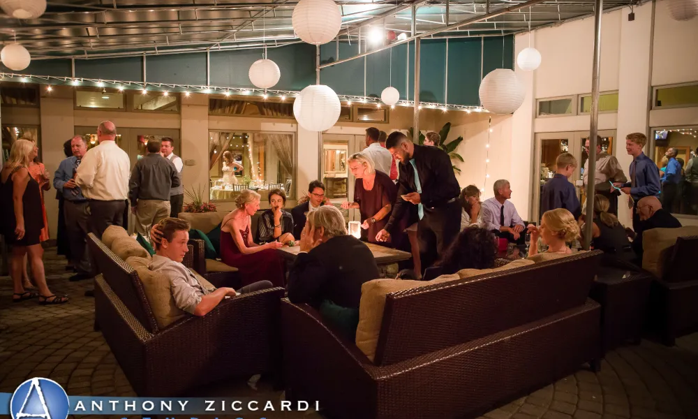 Wedding guests around fire pit at Black Bear outdoor seating area