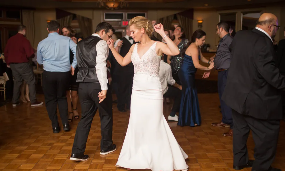 Bride dancing at wedding reception at Black Bear Golf Club