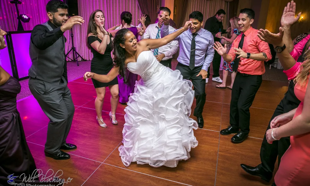 Bride dancing with wedding guests