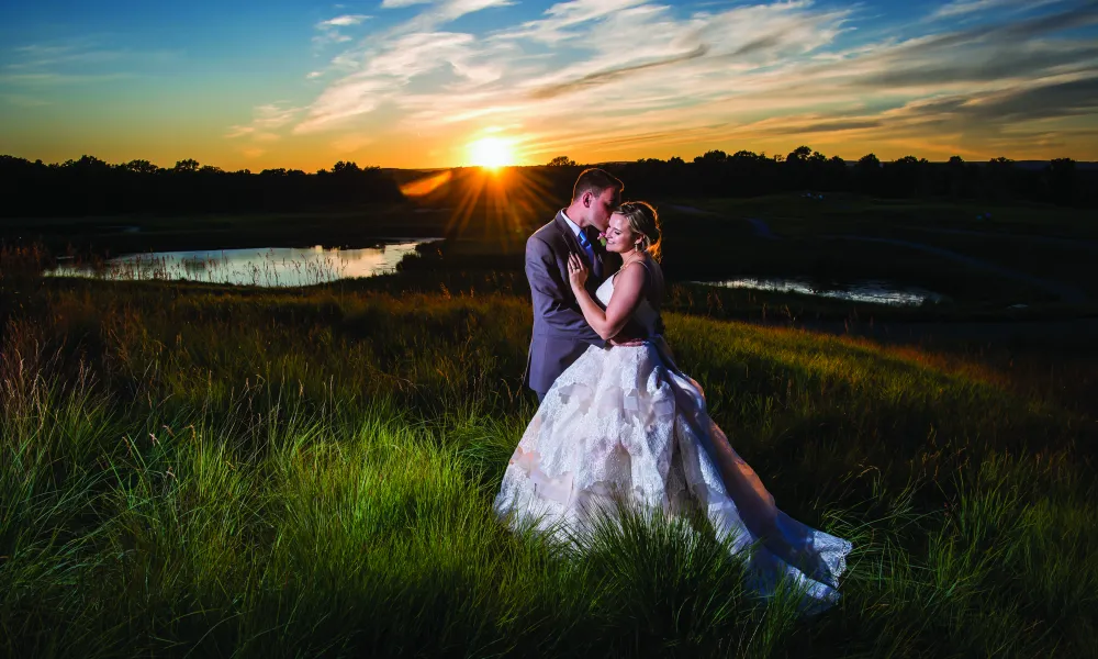 Bride and groom during sunset