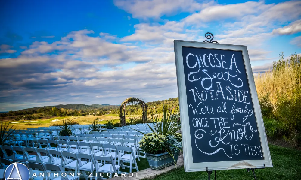 Seating welcome sign at outdoor wedding ceremony at Ballyowen Golf Club