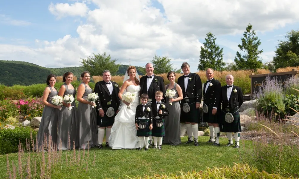 Bride and Groom with wedding party outside Crystal Springs Country Club