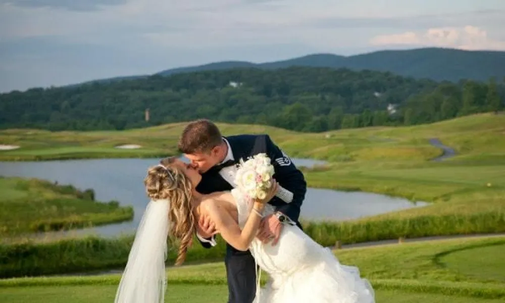 Bride and groom kissing at Crystal Springs Golf Resort