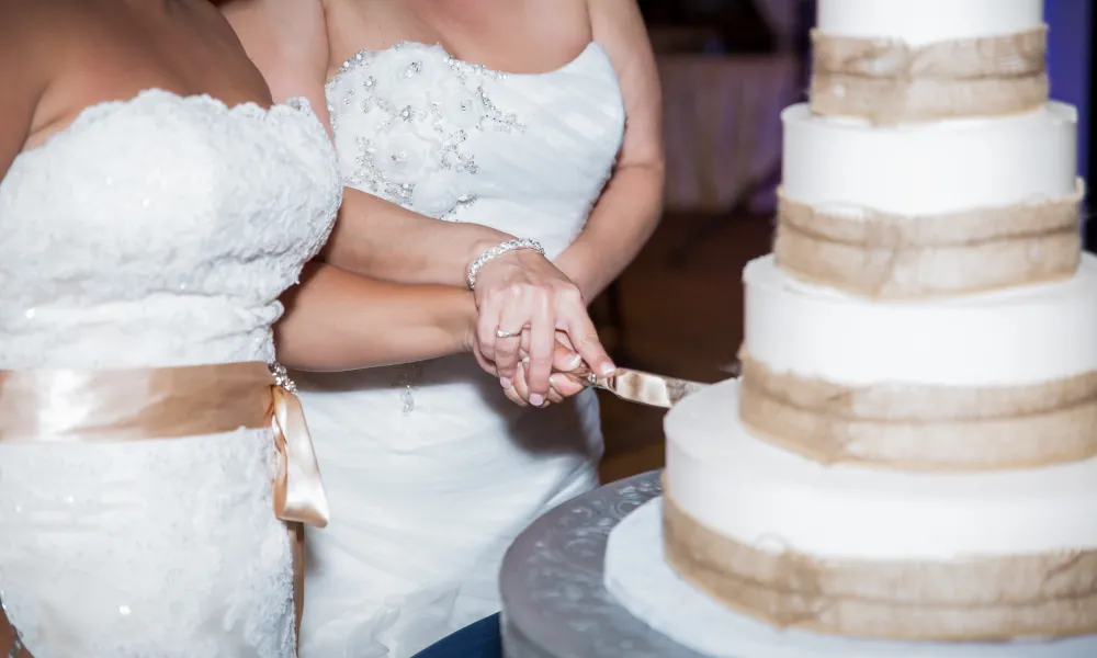 Brides cutting wedding cake