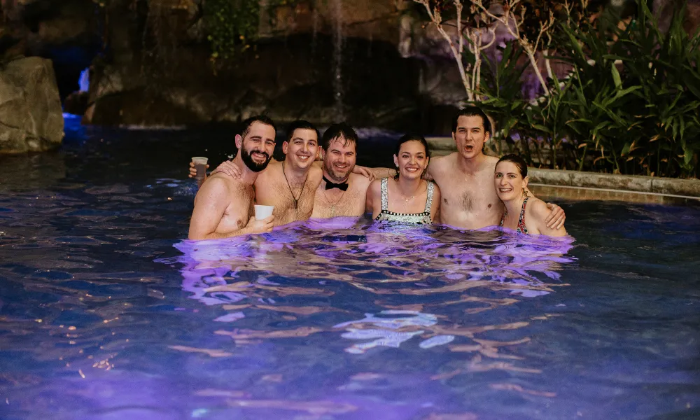 Wedding party in pool at Biosphere