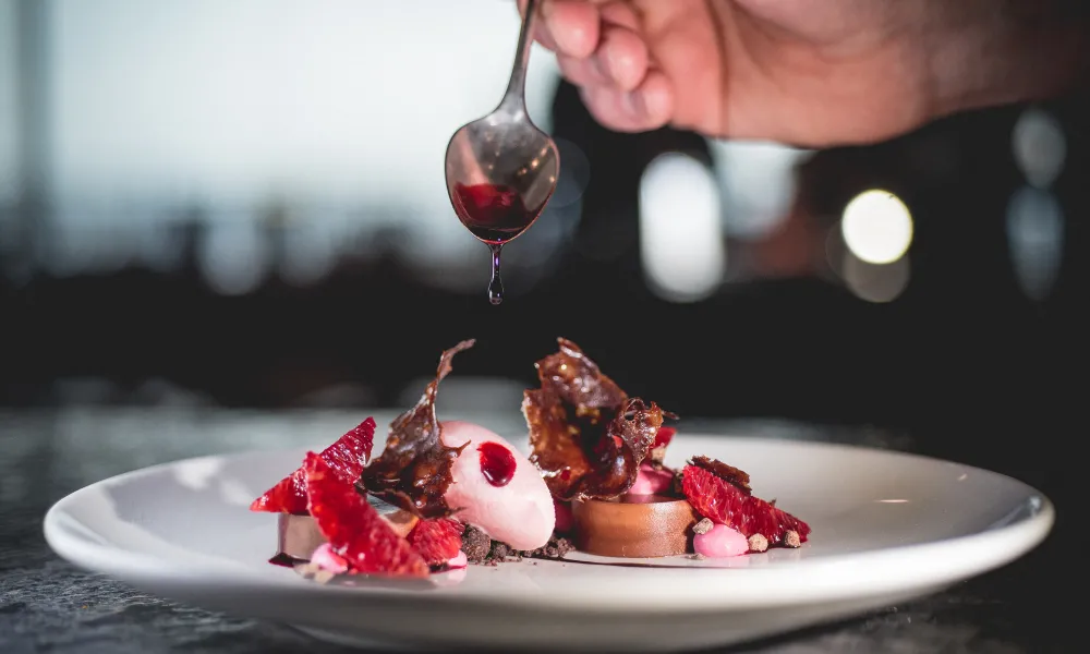 Chef plating a dessert