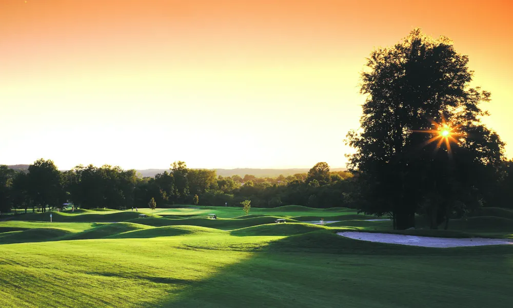 A sunset over the golf course at Black Bear at Crystal Springs Resort