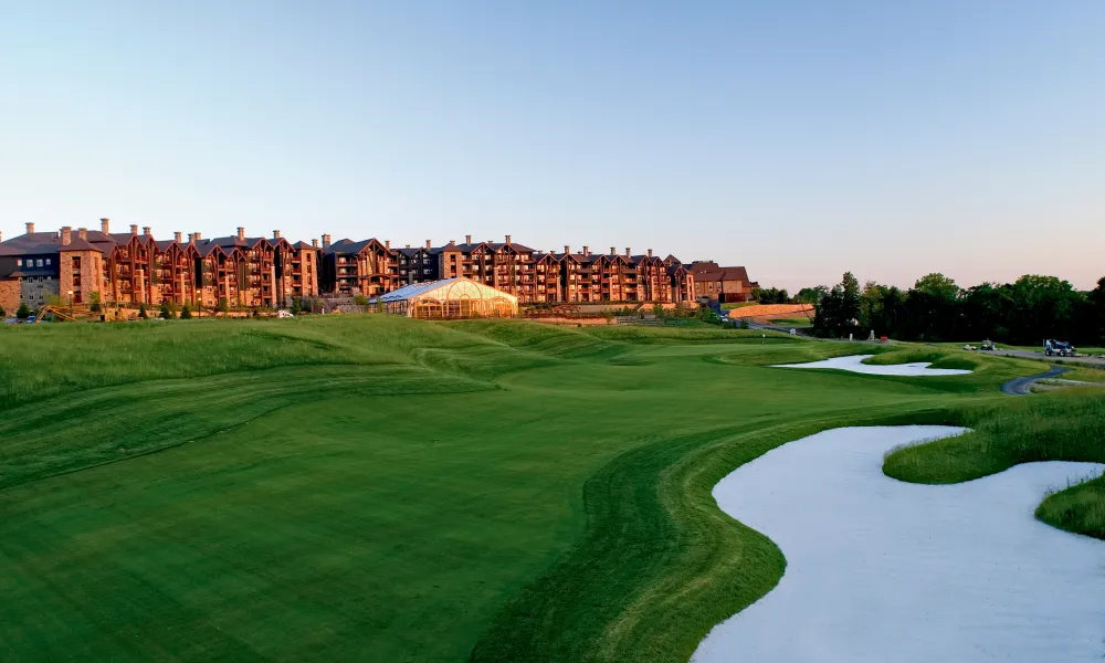 A sunset view of Grand Cascades Lodge from the golf course of Cascades in New Jersey