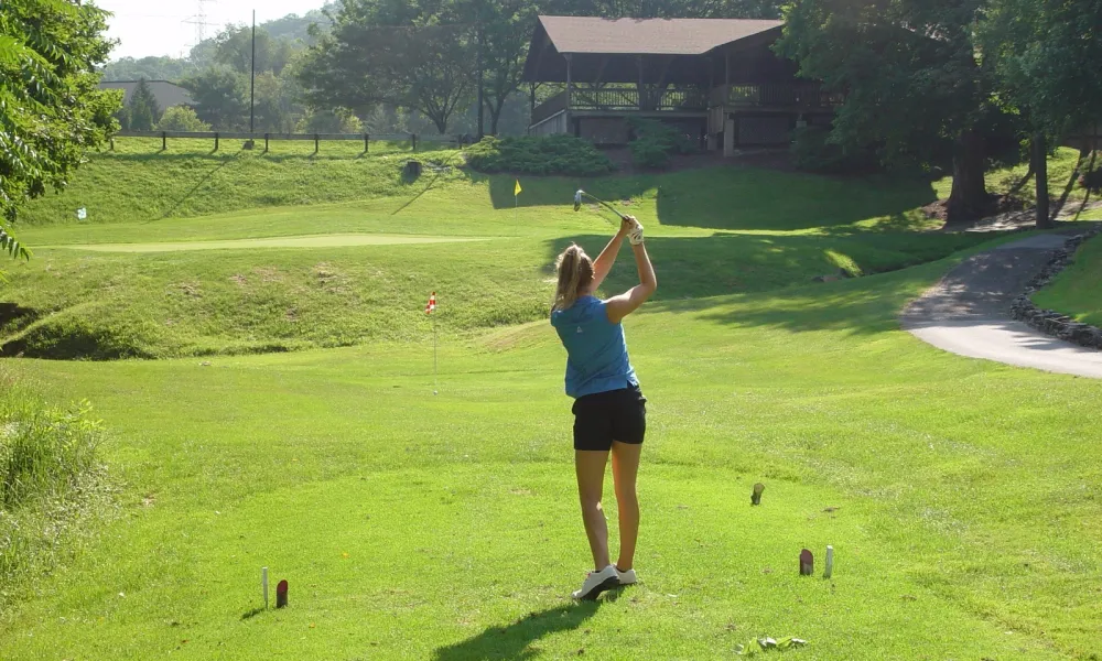 Woman on a golf course at a resort close to NYC