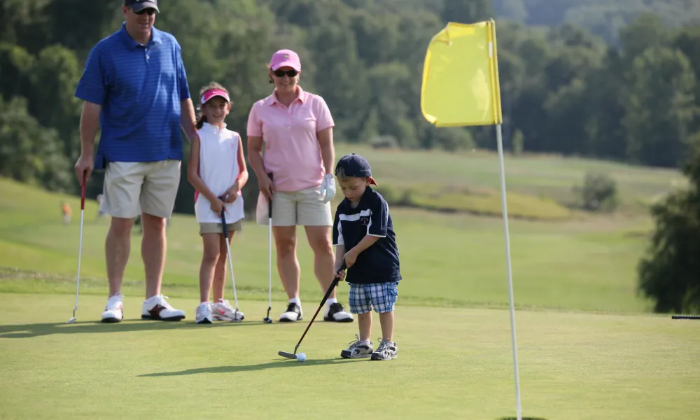 Family golfing at Minerals Golf Course at Crystal Springs Resort