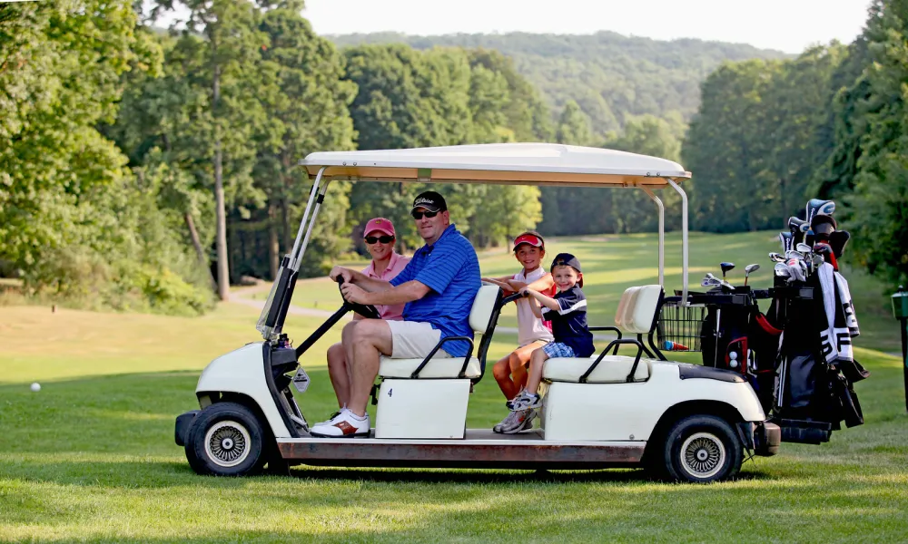 Parents with their kids on a family friendly golf course at Crystal Springs Resort in New Jersey.