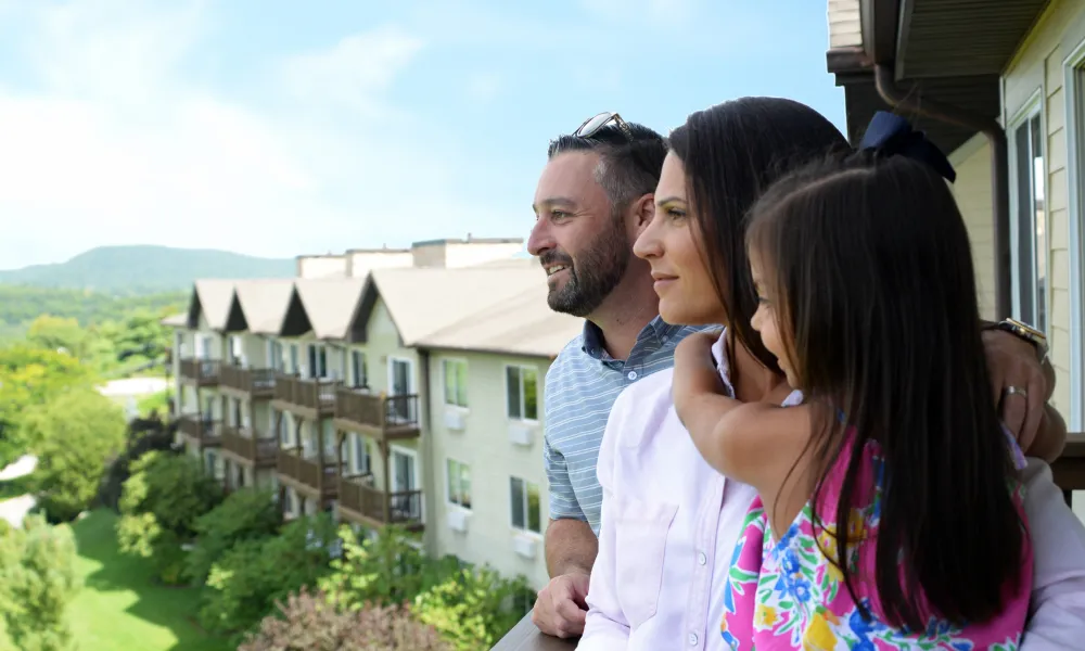 Family standing on balcony at Minerals Hotel.