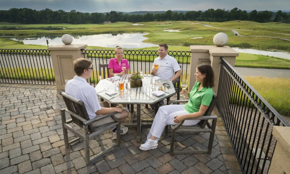 Golfers enjoying a beer at Owen's Pub on Ballyowen golf course