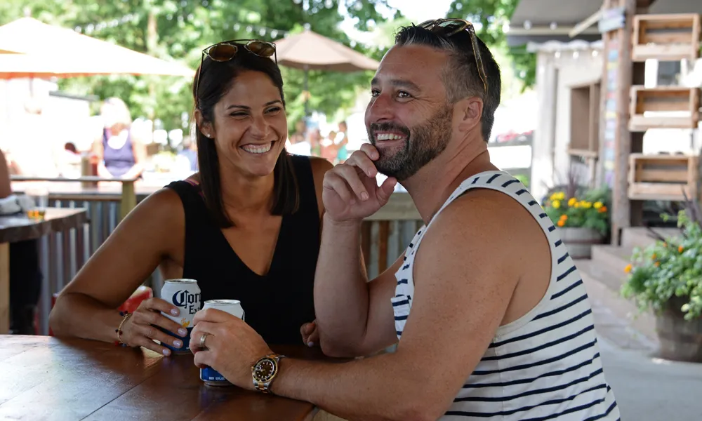 Couple enjoying beer at Moonshine outdoor bar 