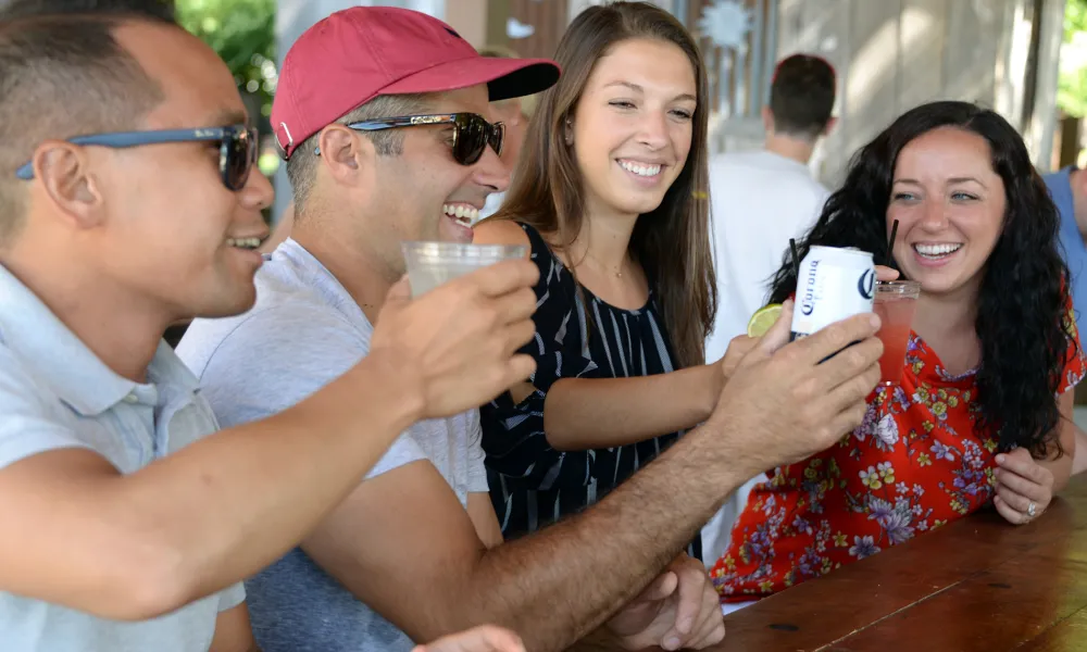 Friends toasting drinks at Moonshine Bar