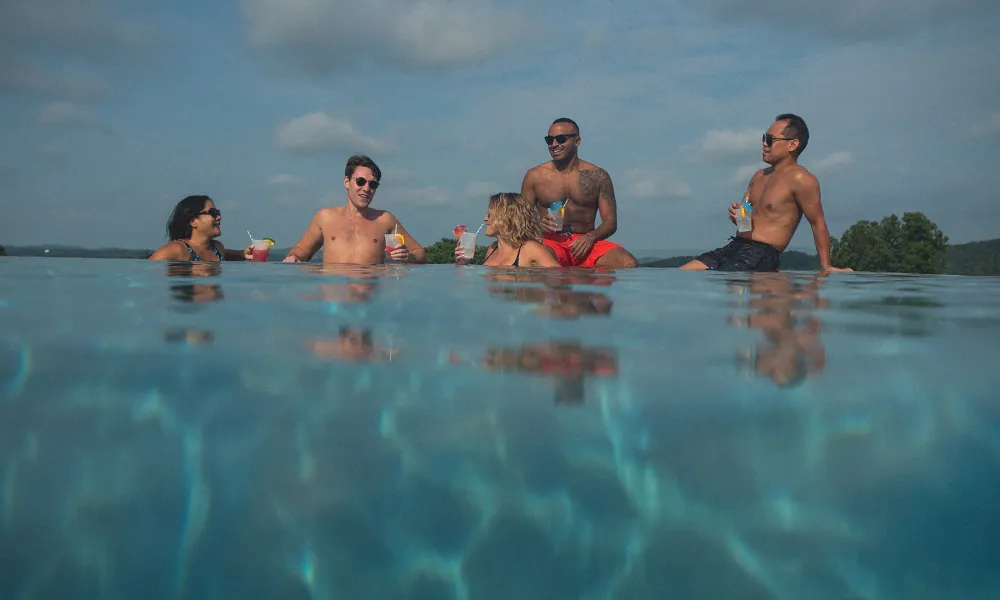 Friends together at an outdoor pool