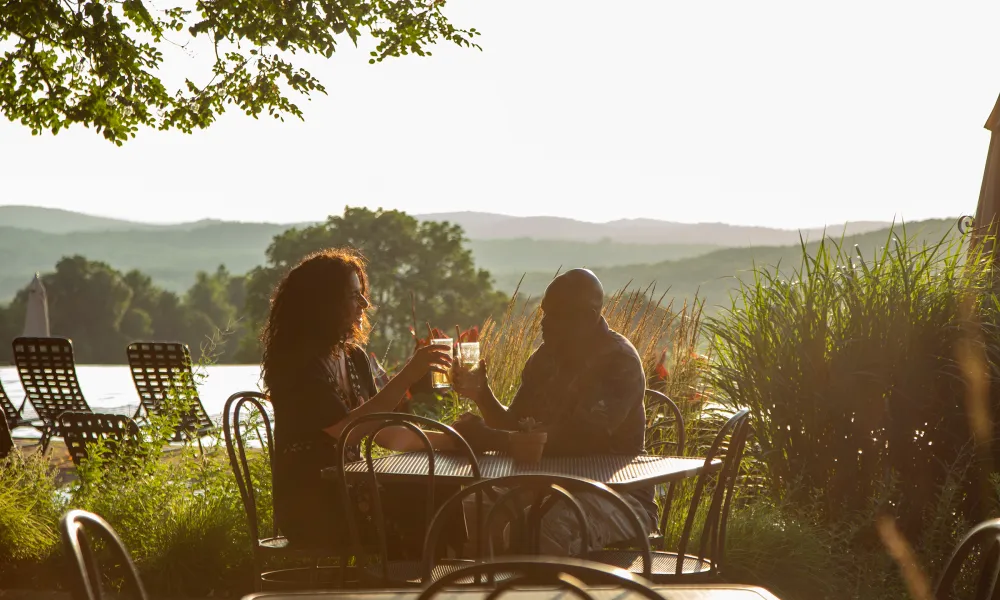 Couple enjoying cocktails at the Vista 180 Cafe at Crystal Springs Resort