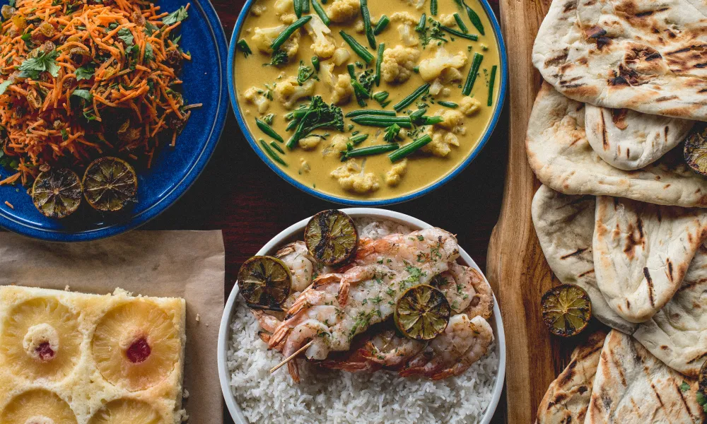 Curry, naan bread, rice and shrimp.