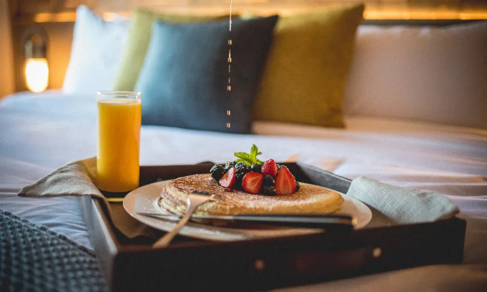 Berry pancakes with orange juice.