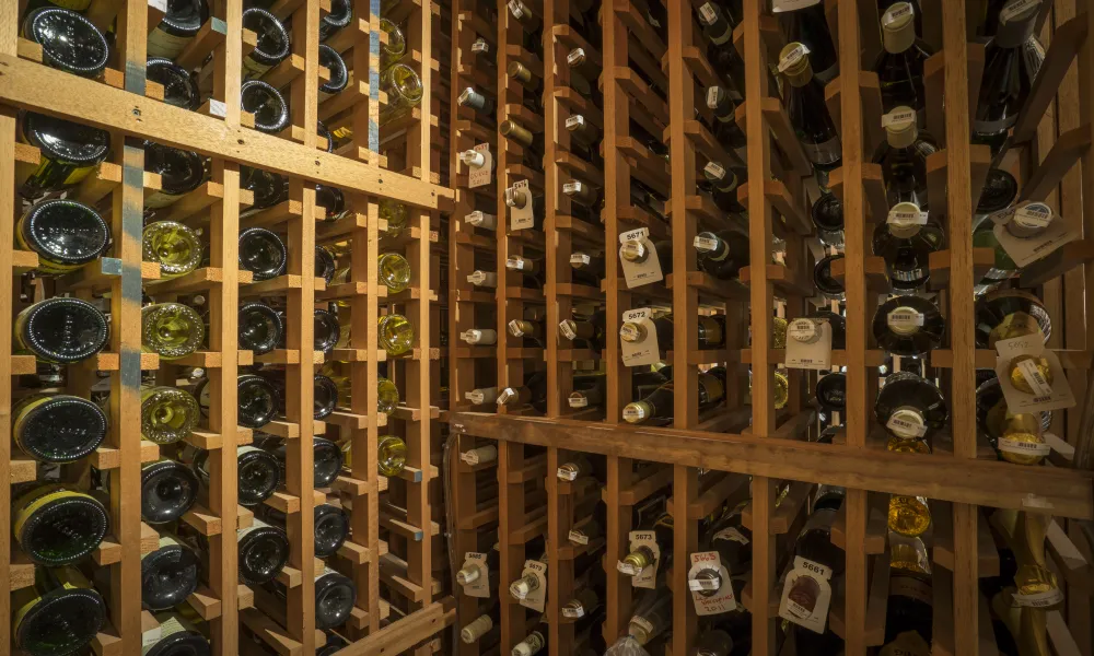 Wine bottles in wooden organizers.