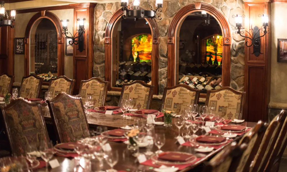 Wine Cellar Bordeaux Room set up long wooden dinner tables.