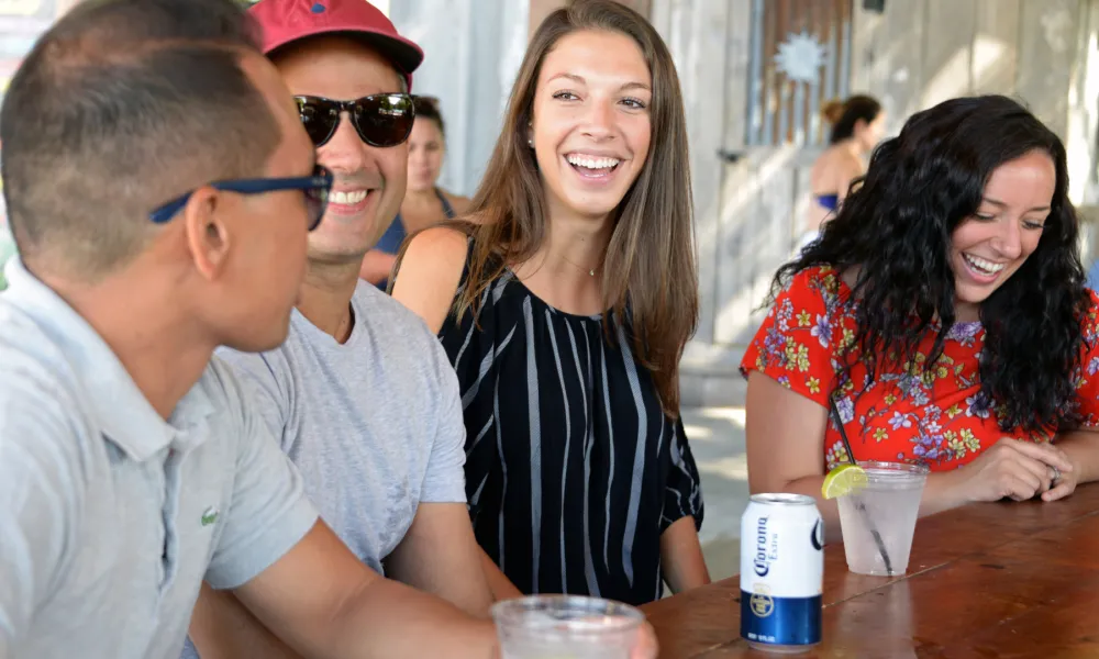 Friends enjoying drinks at Moonshine + The Farmstand