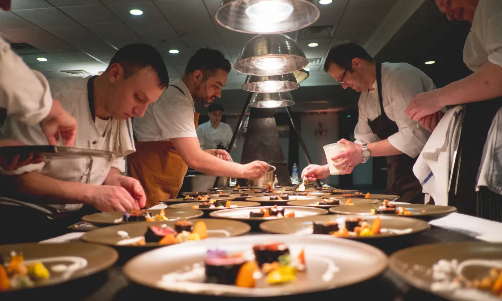 Chefs hard at work plating food at NJ Wine and Food Festival