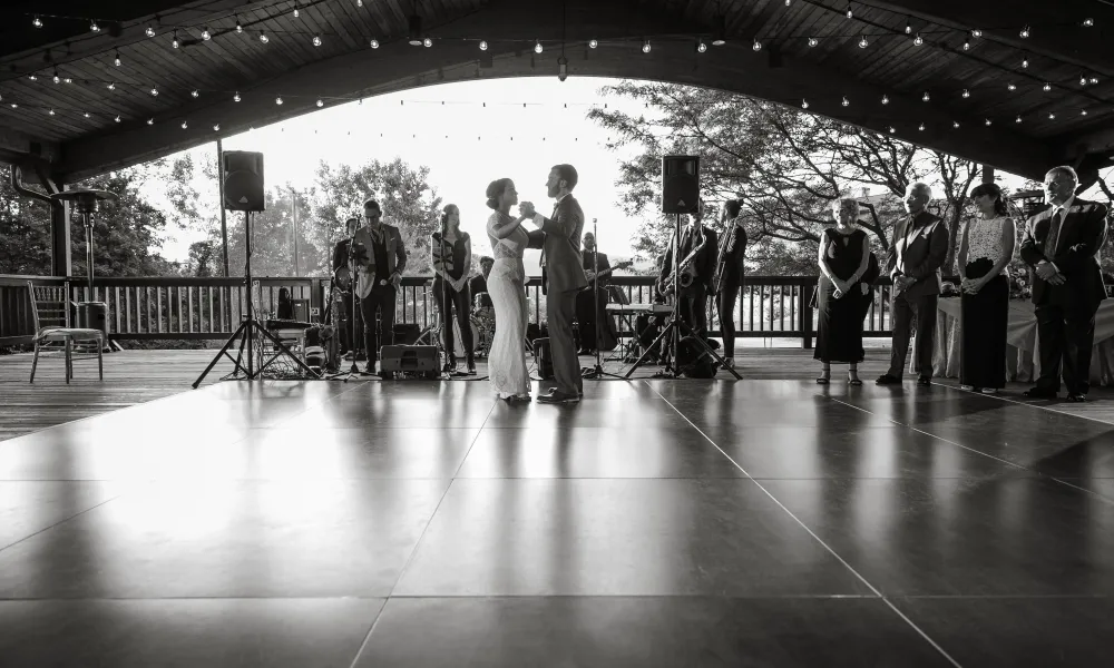 Bride and groom on dance floor in Sweetgrass Pavillion photo in black and white