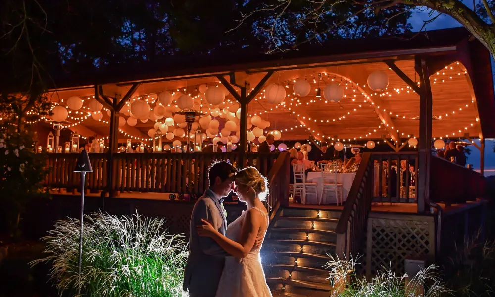 Romantic bride and groom outside of Sweetgrass Pavillion wedding reception