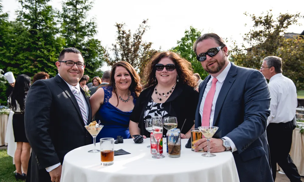 Group of people enjoying cocktail hour at wedding