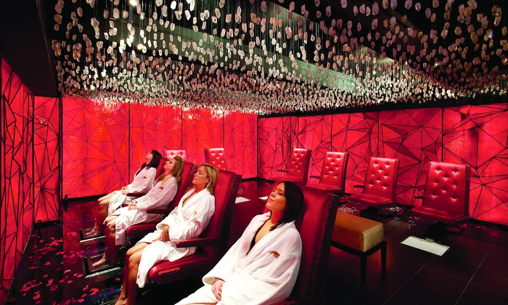 Four women sitting in Reflections Spa foot soak room