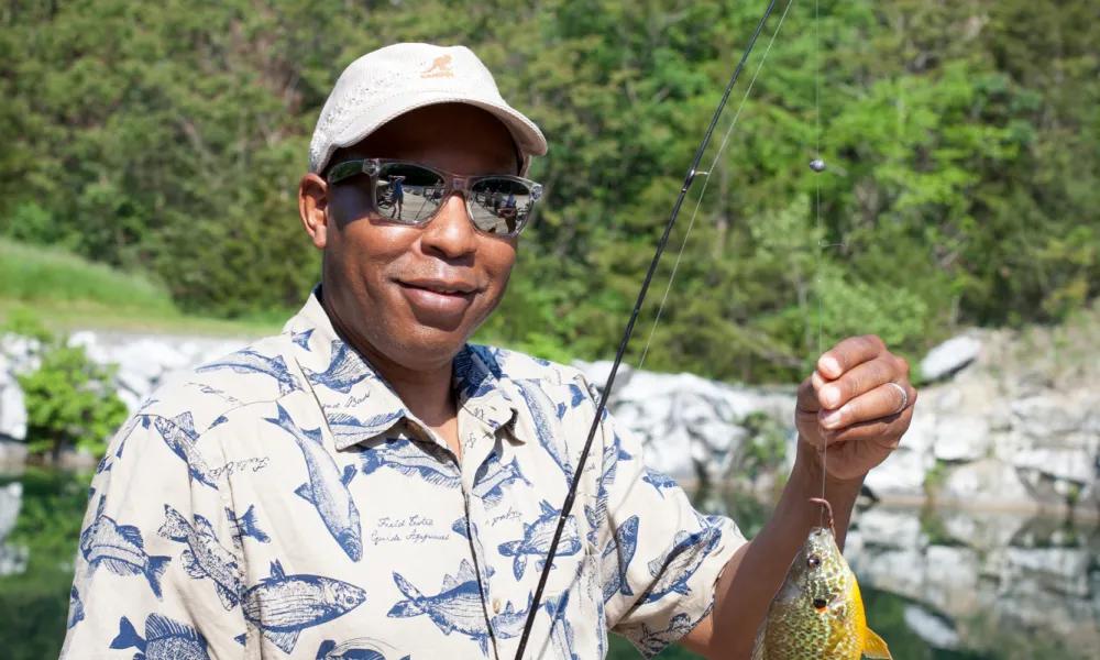 Man holding fish at the quarry