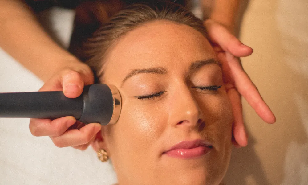 Woman receiving a facial at Reflections Spa