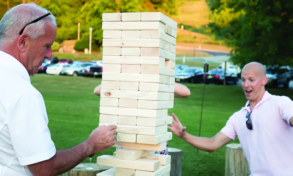 A couple of guys playing Jenga