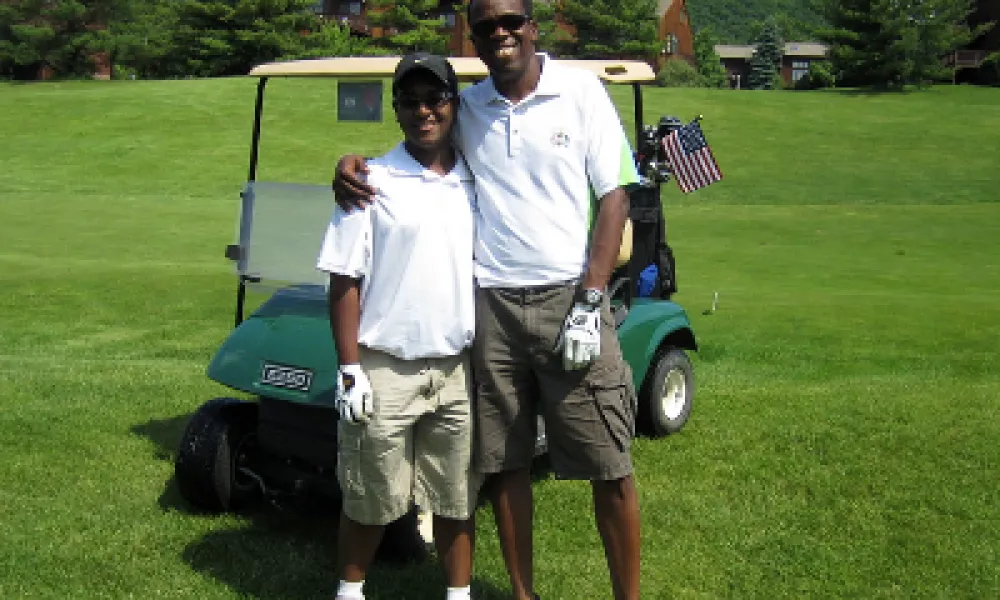 Father and son on a golf course a Crystal Springs Resort