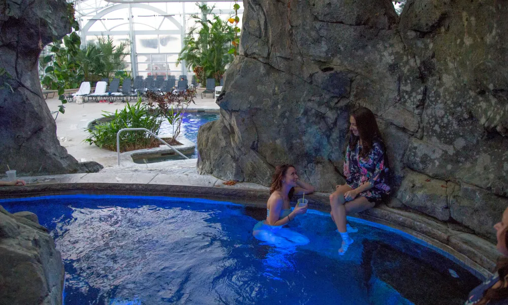 Two women in biosphere hot tub.